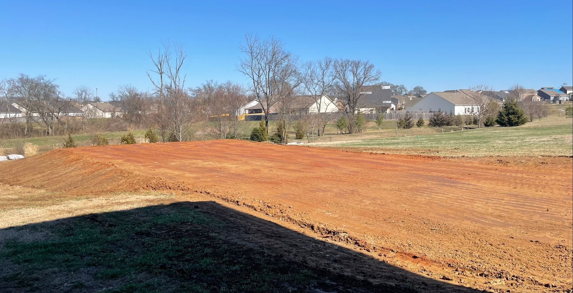 There is a lot of dirt in the middle of the field.
