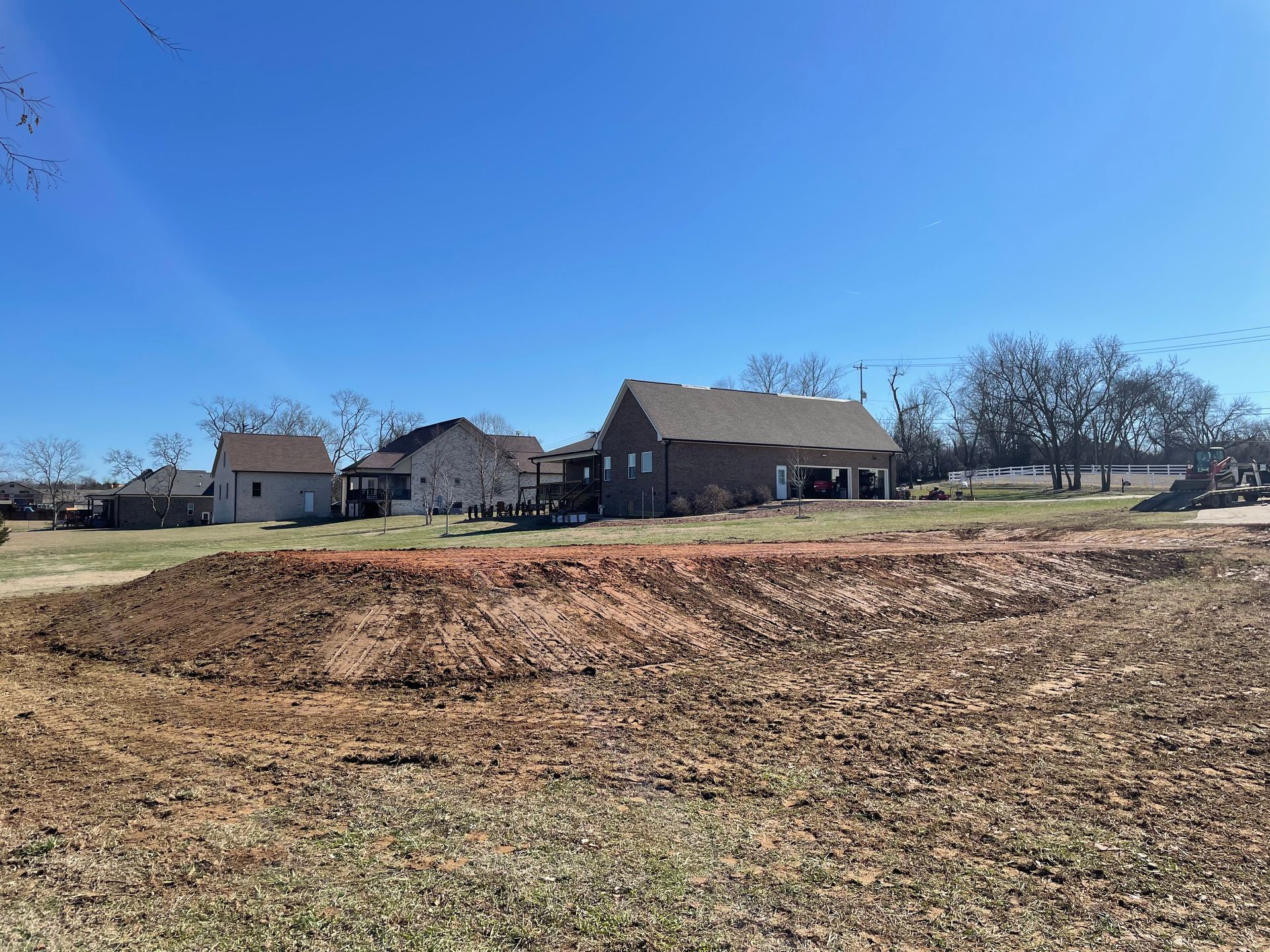 There is a house in the middle of a field.