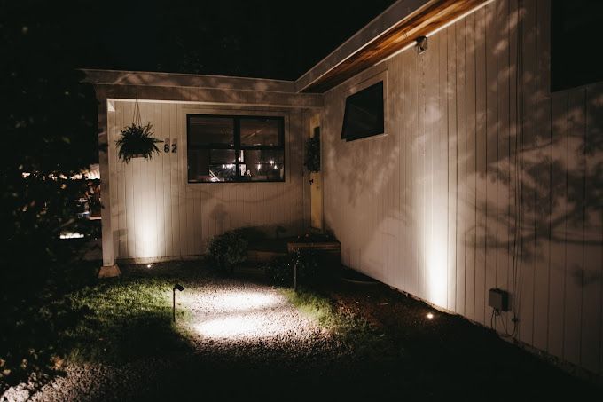 landscape lighting with accent lighting, uplighting, wall washing, downlighting, and pathway lighting