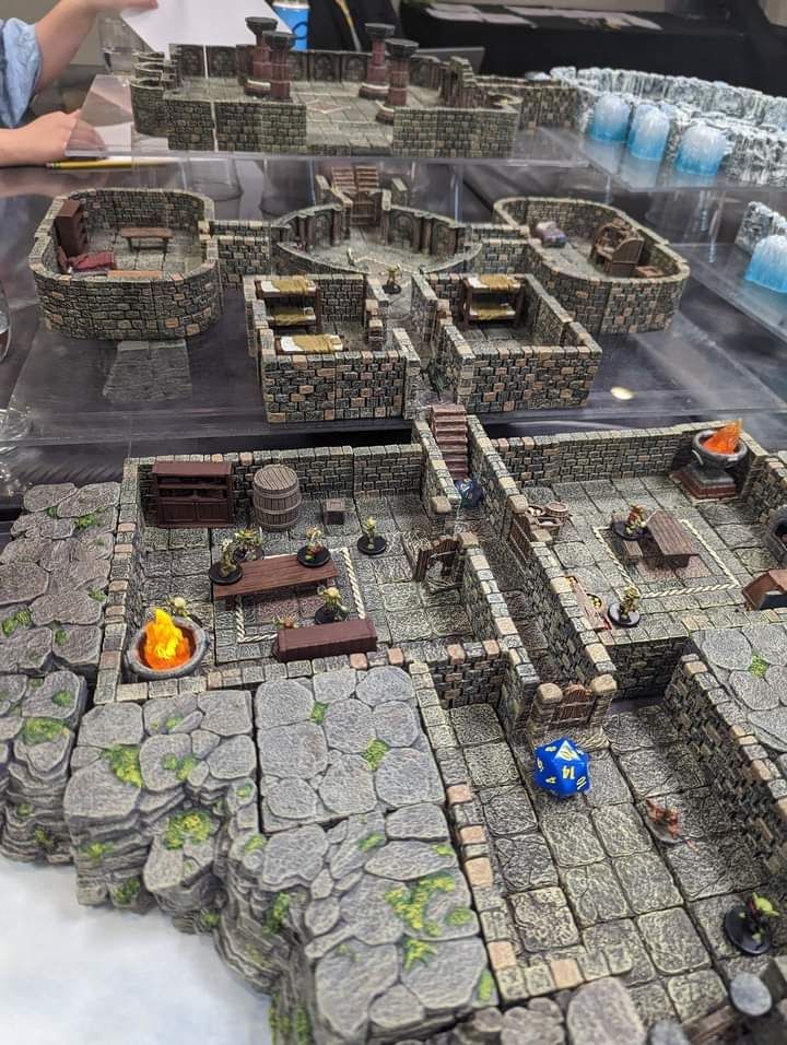 A table with a model of a dungeon on it.