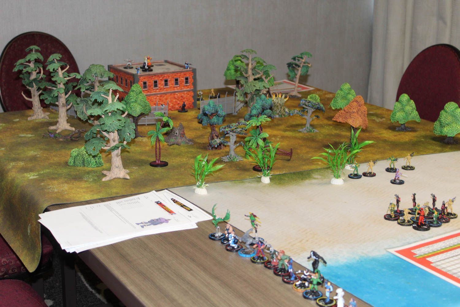 A table with a bunch of miniature figures on it