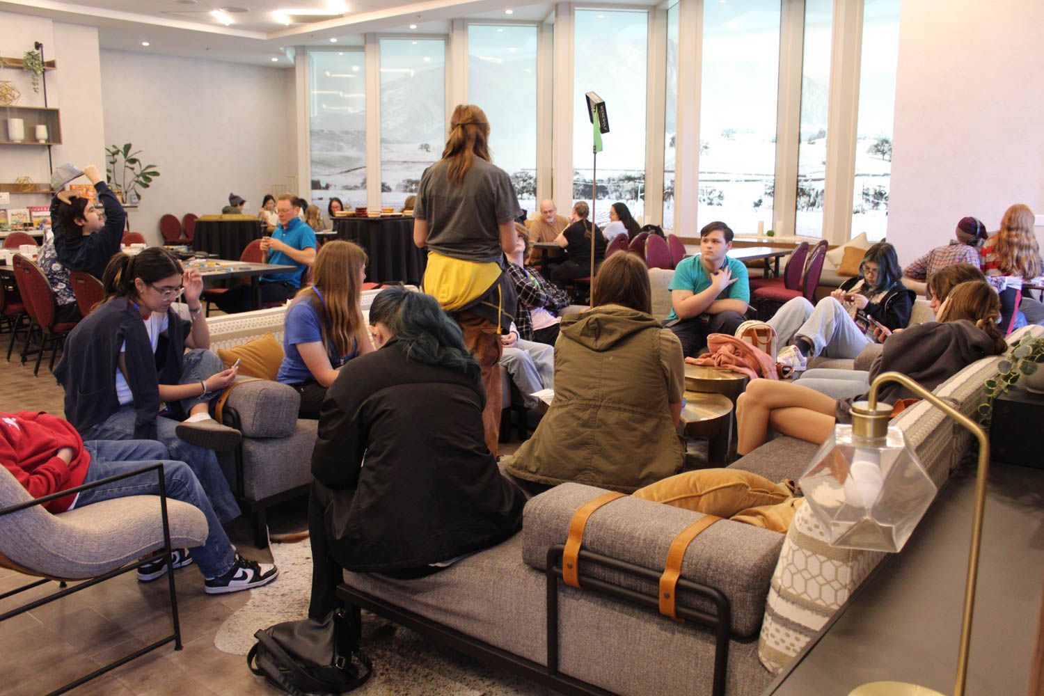 A group of teens playing the game Werewolf in the Board Game Library.