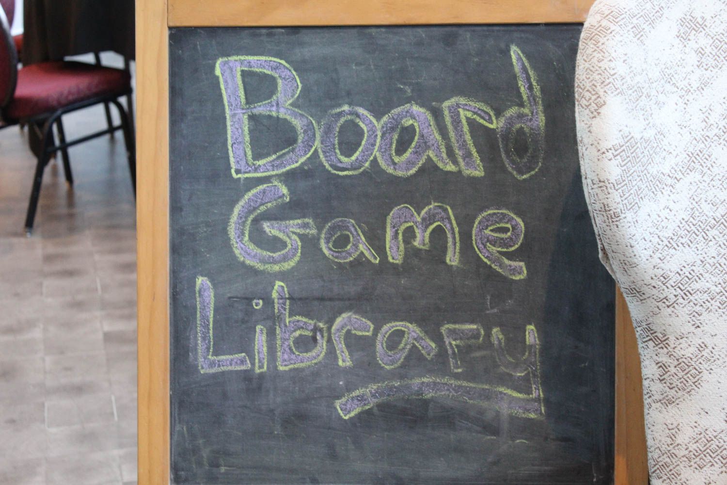 A chalkboard with the words board game library written on it at GameSchoolCon in Irvine, CA.