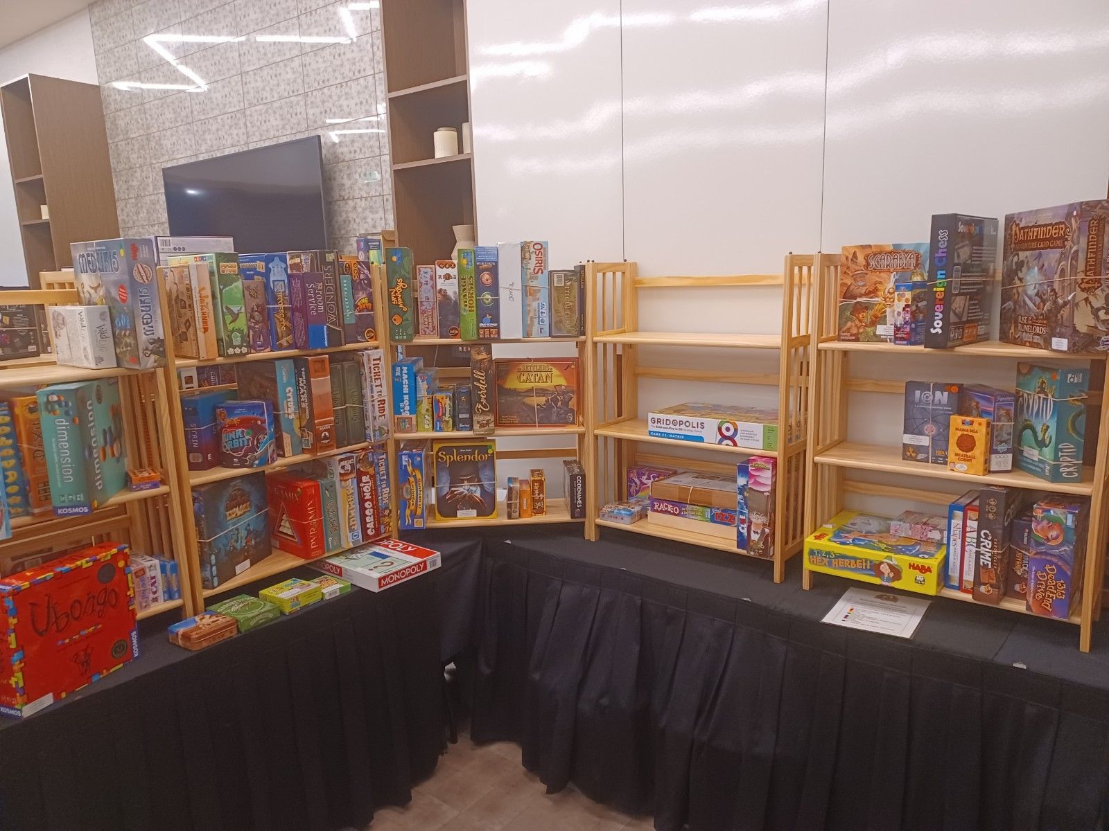 An image of a corner of the board game collection in Board Game Library at GameSchoolCon in Irvine, CA.the 