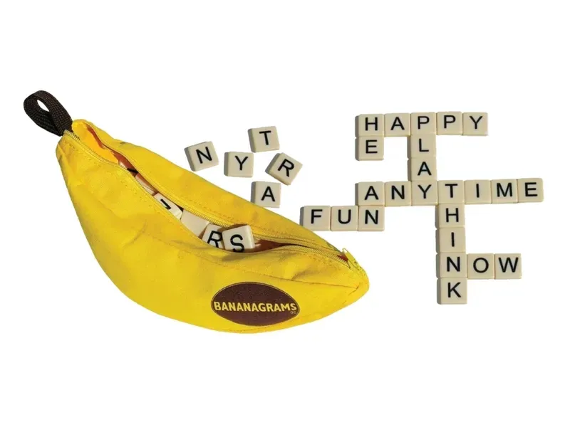 Banana-shaped pouch with word tiles scattered around, spelling words like 