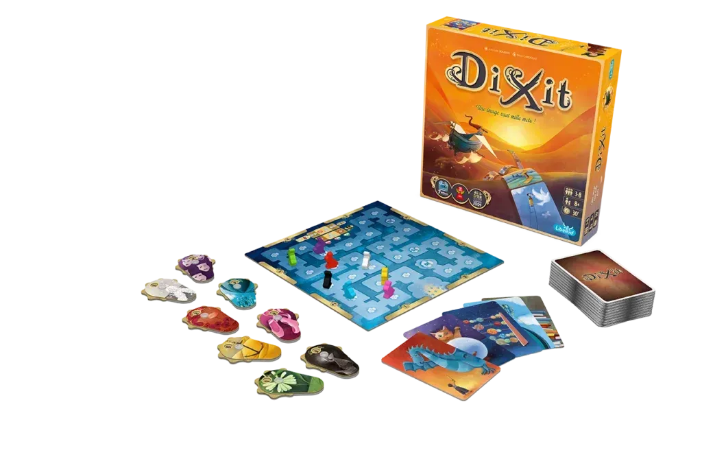 Dixit storytelling game with colorful illustrated cards spread across the table.