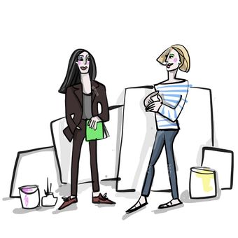 Art historian Tanja Pol and client in an artist's studio, surrounded by blank canvases and paint buckets.