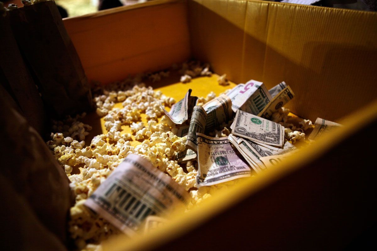 Popcorn mixes with money collected from popcorn sales during intermission at the Zoppe Family Circus.