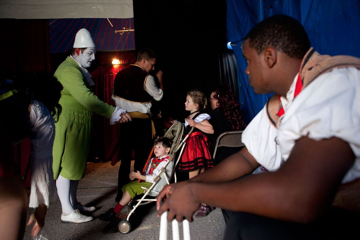 Members of the circus wait to enter the ring. 