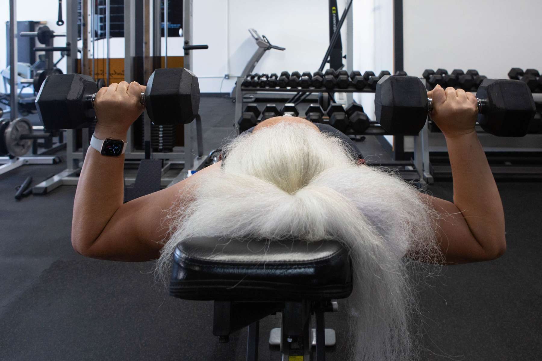 Older woman with silver hair working out