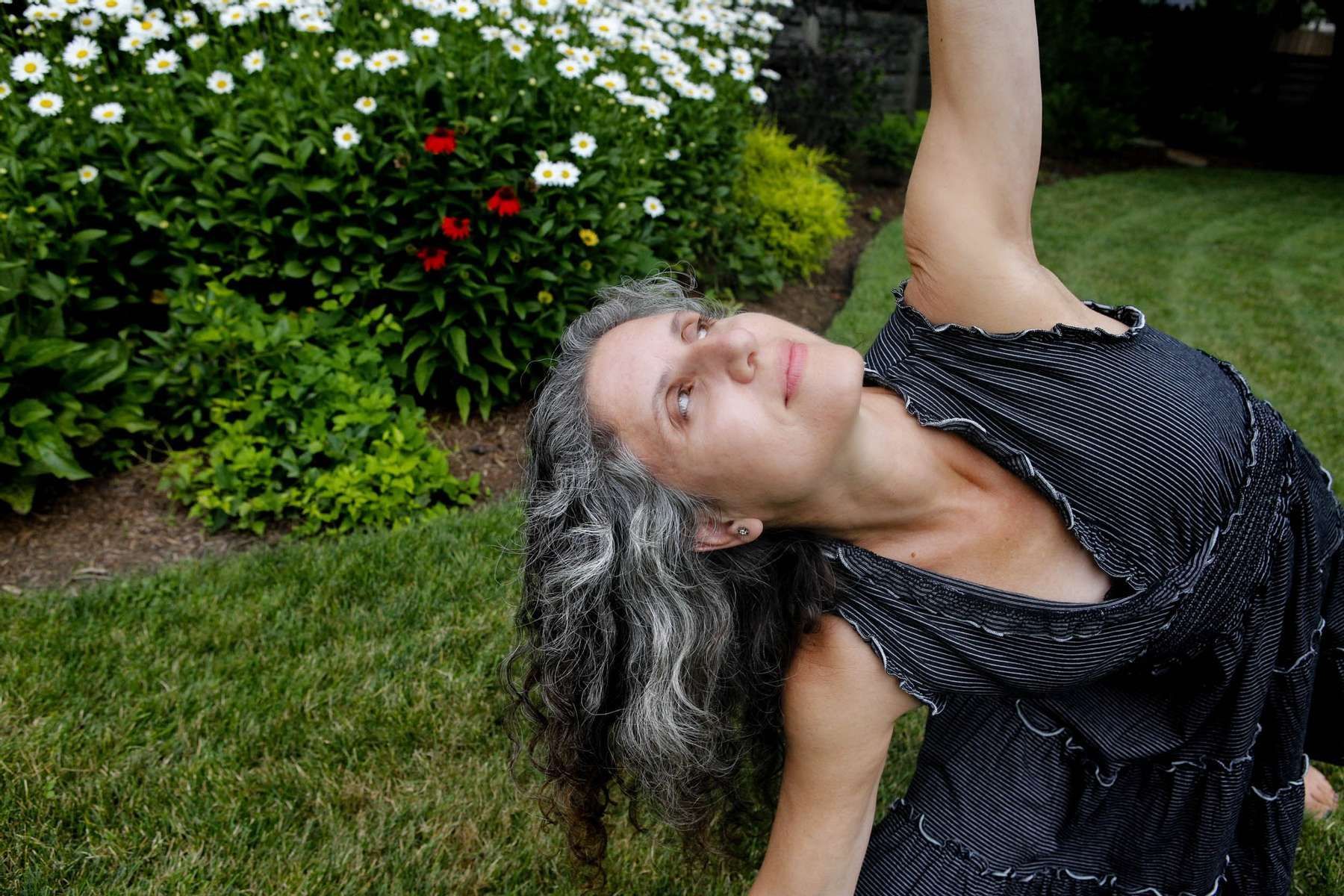 Yoga teacher with gray hair