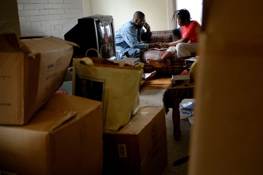 Lamin and Victoria discuss their impending move amid all their boxes.
