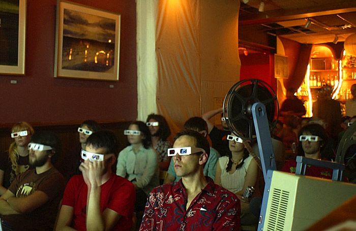 Members of an audience at Casa Cantina watch a 3-D movie during a special Casa Collections event on April 20, 2004. The night was a celebration of the 'holiday' 4.20, which celebrates various ways of smoking marijuana and the experience of being high.