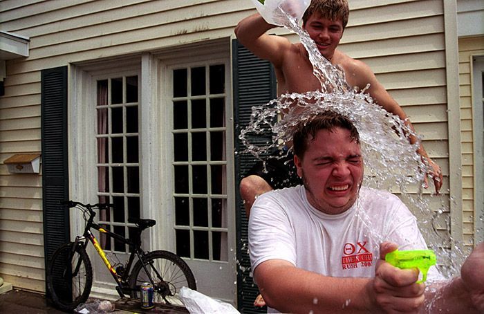 Brian Veek dumps water on Nick 'Chops' Dunston during their spring philanthropy event.