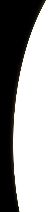 White, crescent-shaped object against a black background.