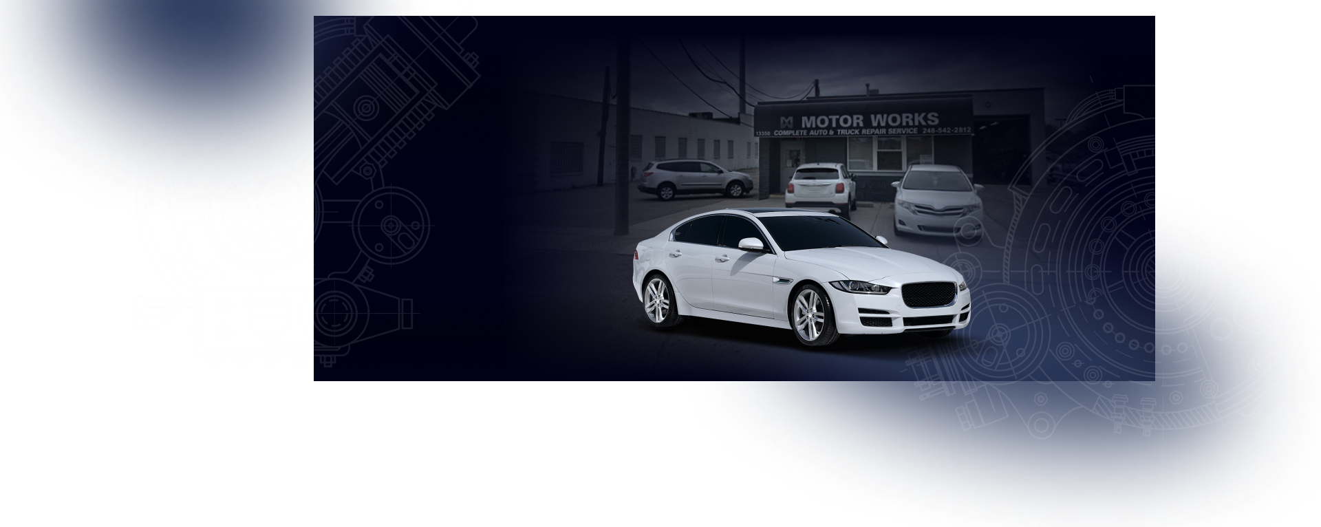 A white car is parked in front of a building. | Motor Works