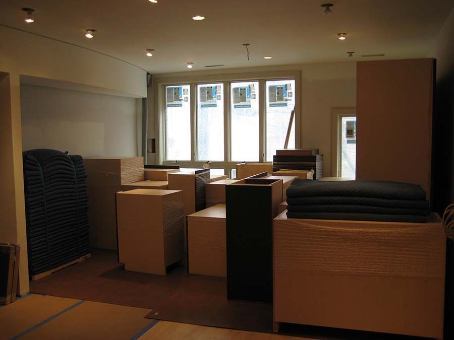 A room with a lot of furniture and a window from Cupboard Wagon cabinet delivery services