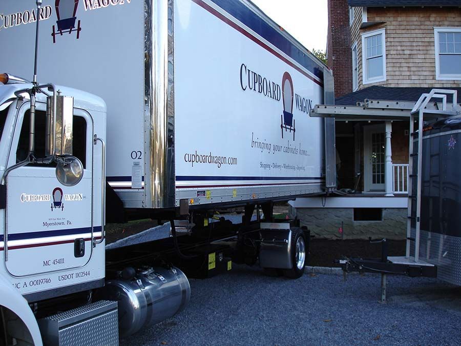 A truck with the word chicago on the side from Cupboard Wagon cabinet delivery services