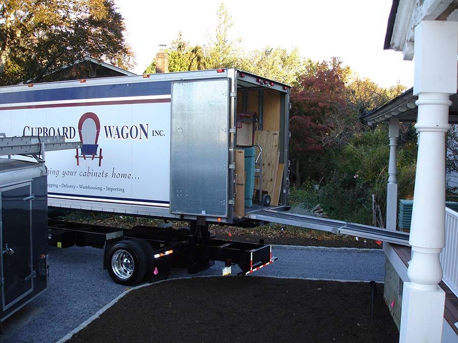 The word wagon that is on a truck from Cupboard Wagon cabinet delivery services