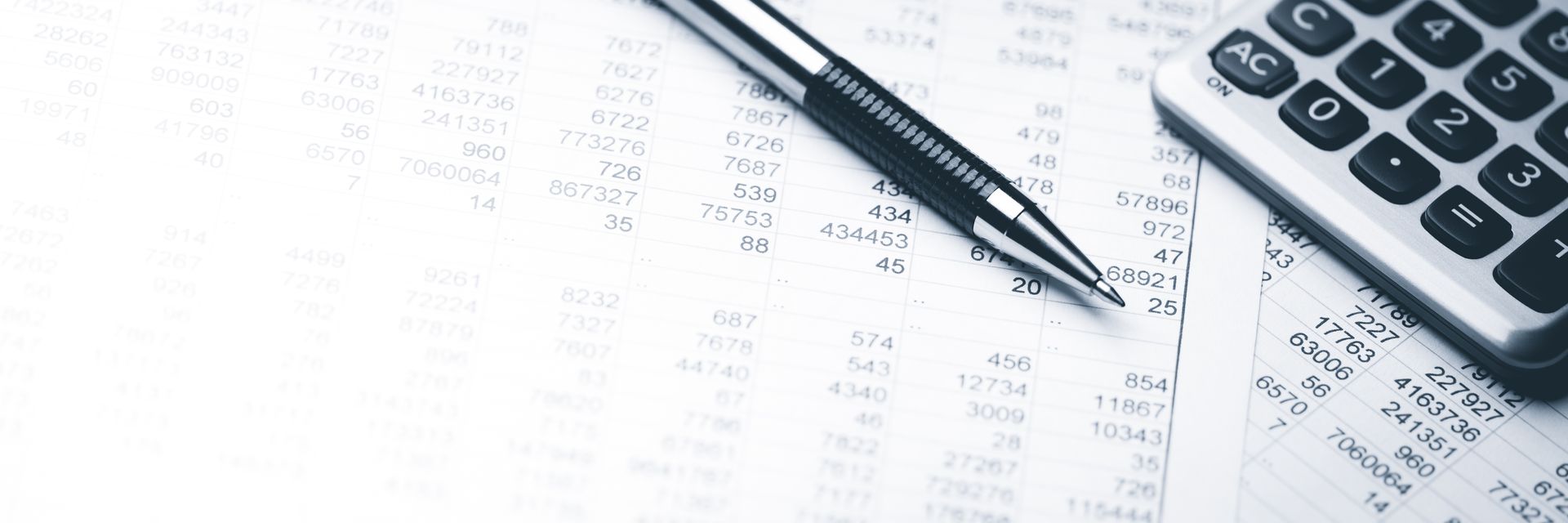A pen, calculator, and financial documents, suggesting accounting or budgeting tasks. A pen, calculator, and financial documents, suggesting accounting or budgeting tasks.