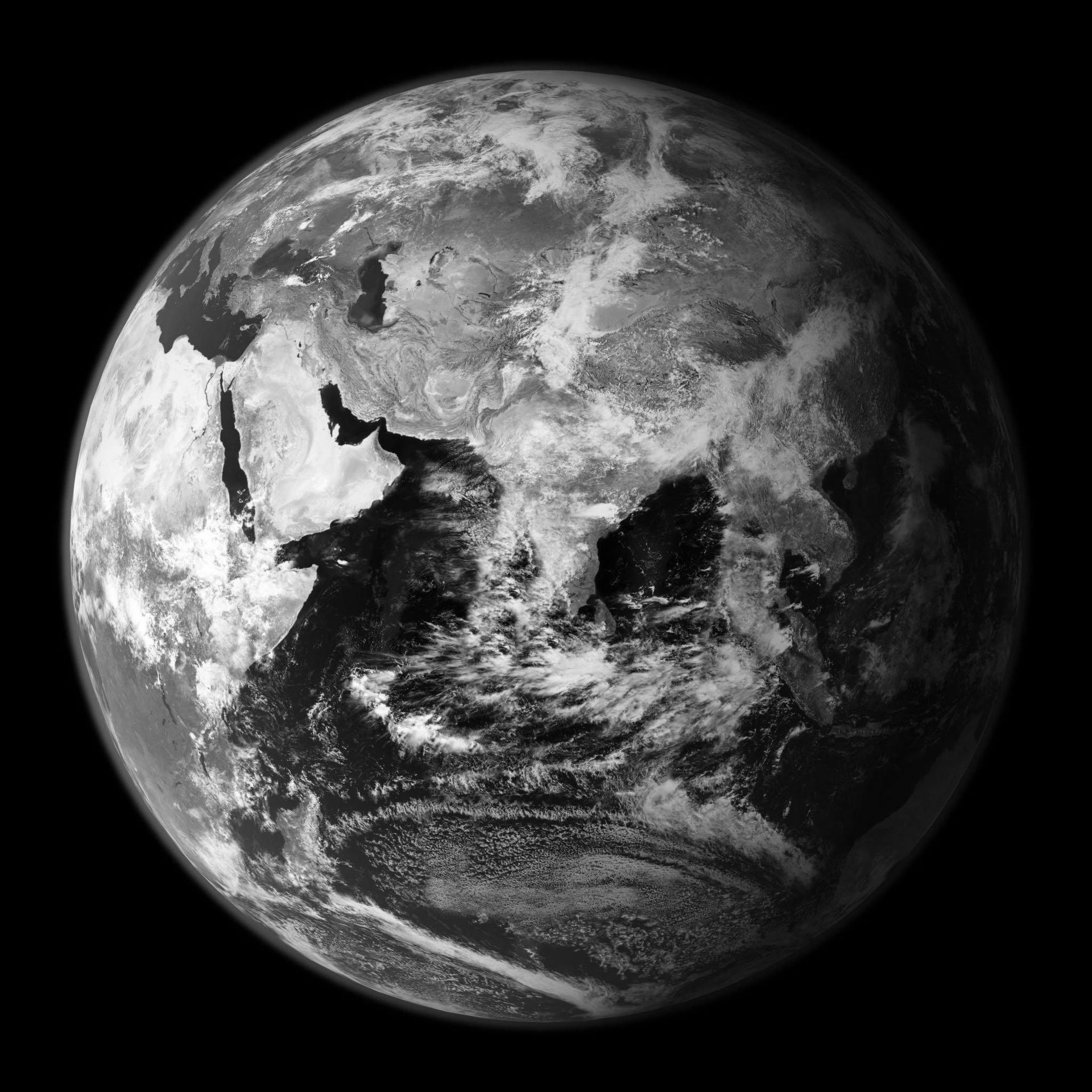 A black and white photo of the earth from space