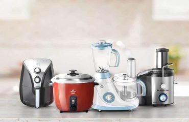 A group of kitchen appliances sitting on top of a counter.