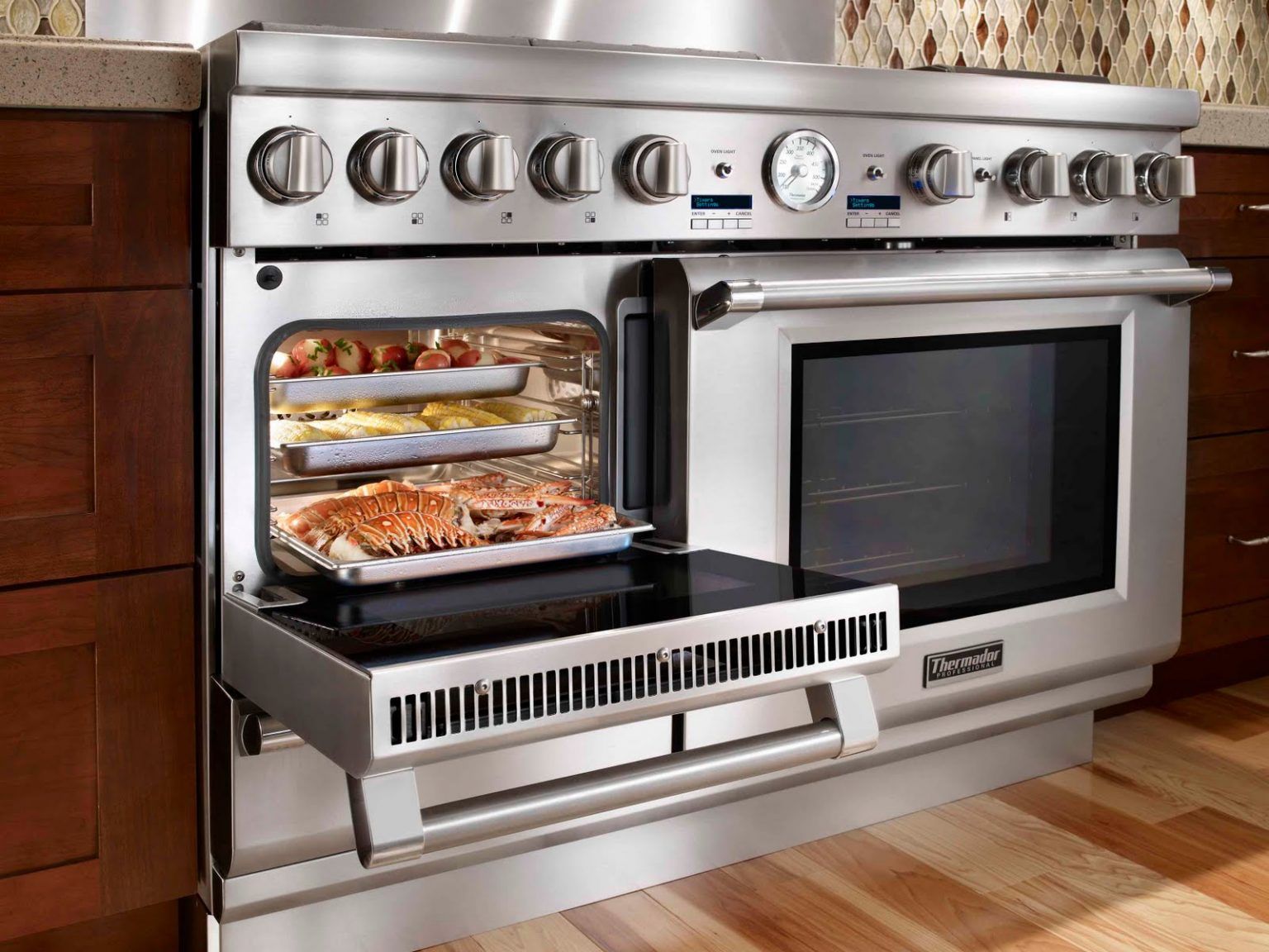 A stainless steel oven with the door open and food in it