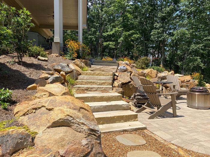 natural stone, paver patio, backyard oasis with fresh landscaping