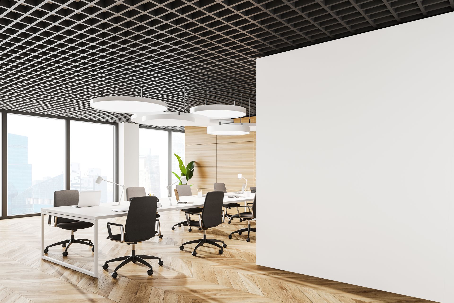 Modern office space, with open layout, desks, chairs, large white board, and patterned ceiling.