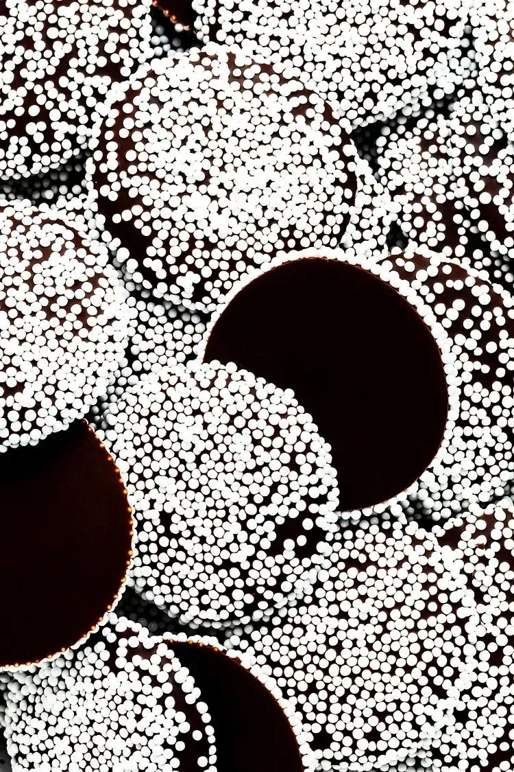 Tablet displaying a website with apartment photos, resting on a bed with wood.