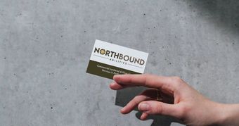 Hand holding business card with