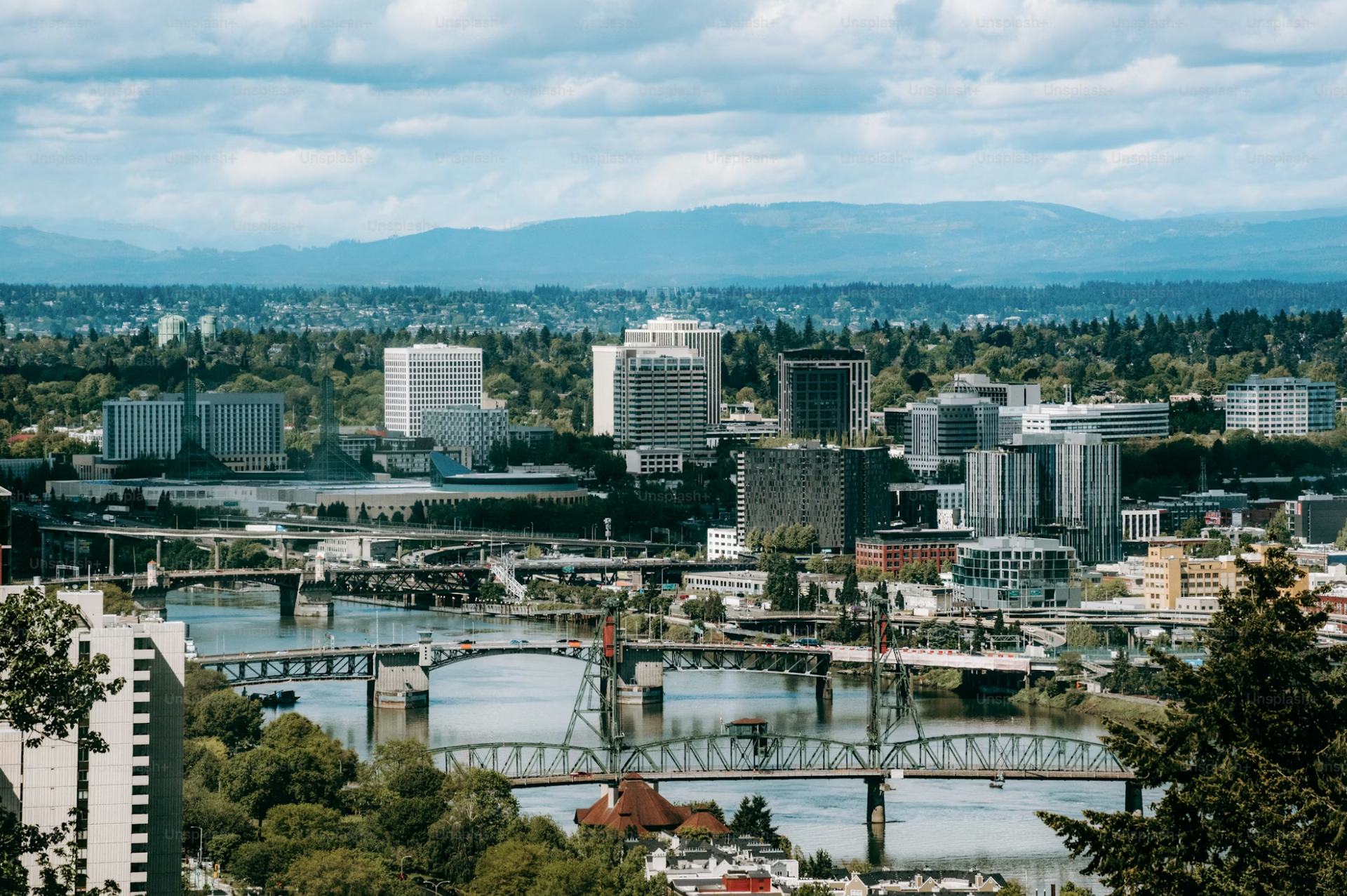 Tablet displaying a website with apartment photos, resting on a bed with wood.
