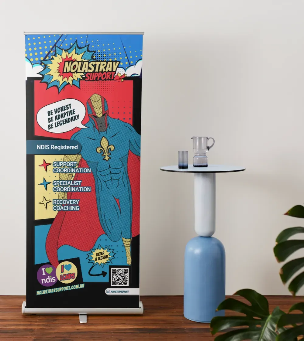 Roll-up banner with superhero, text, and QR code, next to a small table with water pitcher and glasses.