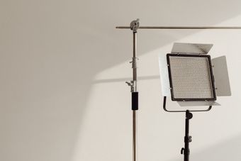 Person typing on a laptop, viewing a document on the screen.