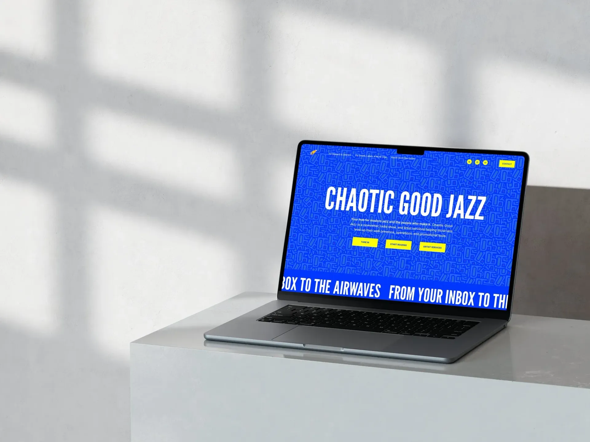 Laptop displaying a website for 