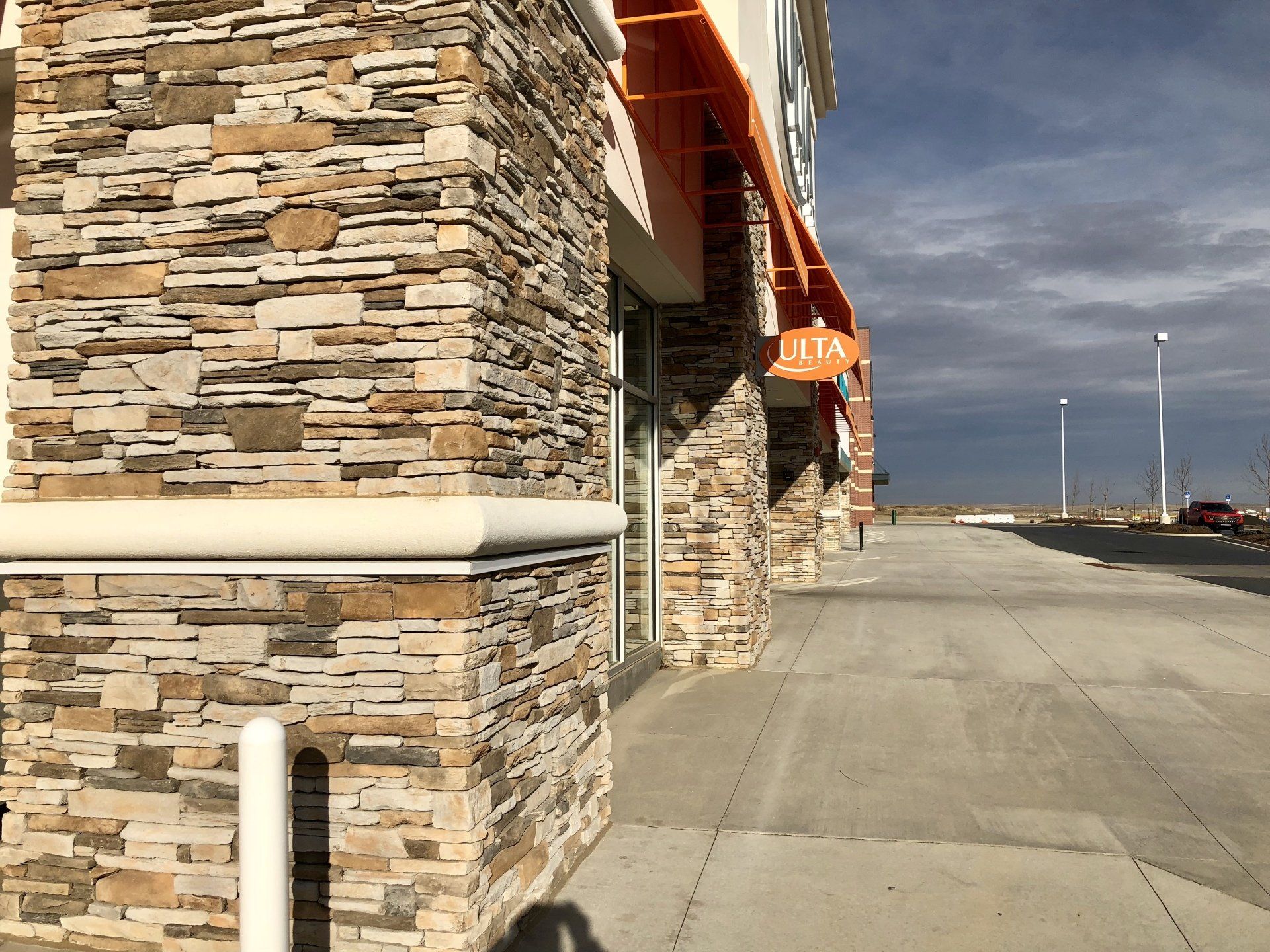 Commercial Masonry — Shopping Center Side View of Masonry  in Pueblo, CO
