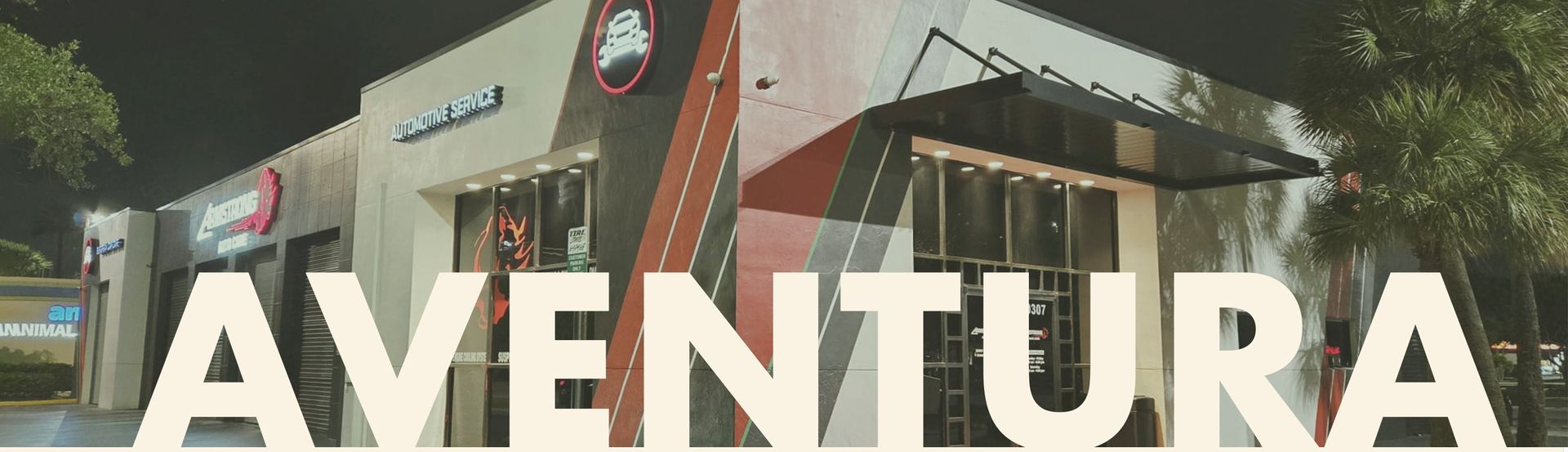 Front view of Armstrong Auto Care in Aventura, Florida – upscale auto service center with clean exterior, branded signage, and accessible parking.