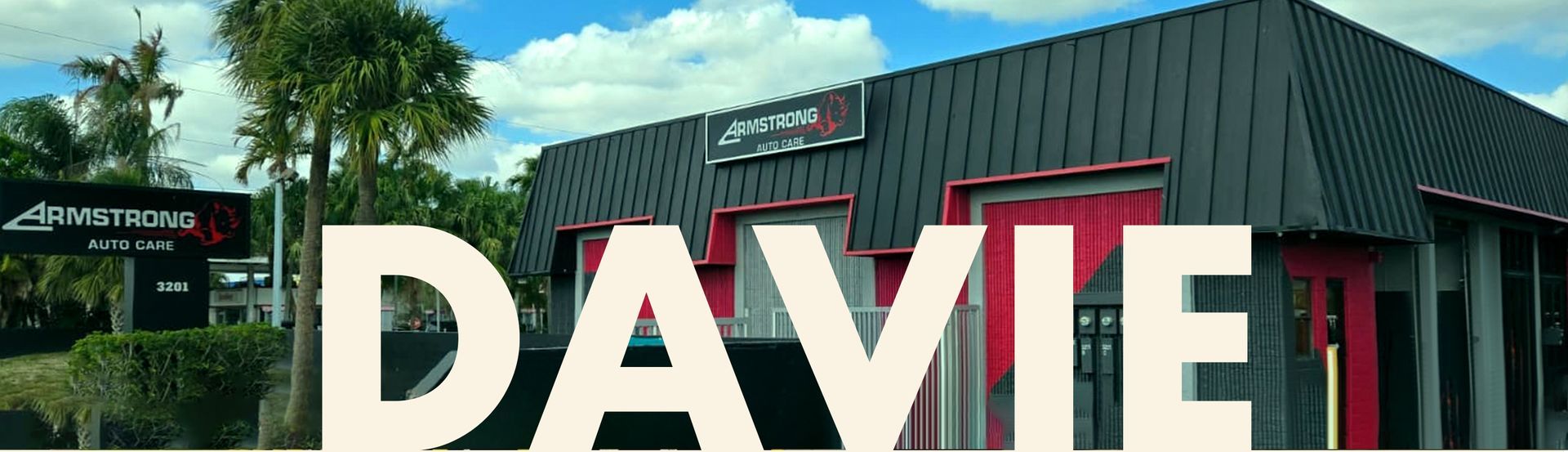 Exterior of Armstrong Auto Care auto repair shop in Davie, Florida – modern facility with visible signage, service bays, and customer parking area