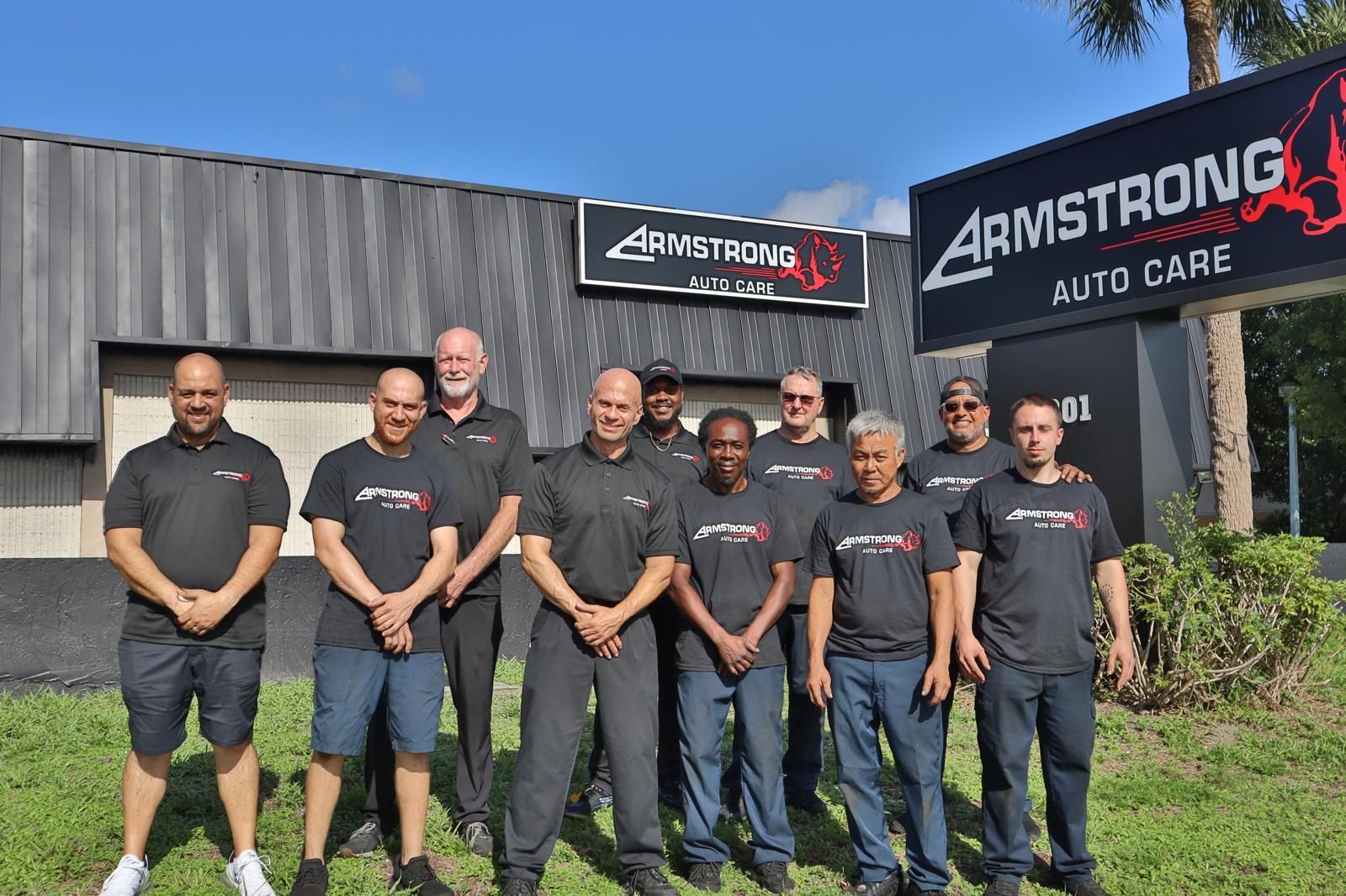 Auto Repair Team Group In Front Of Building  | Armstrong Auto Care