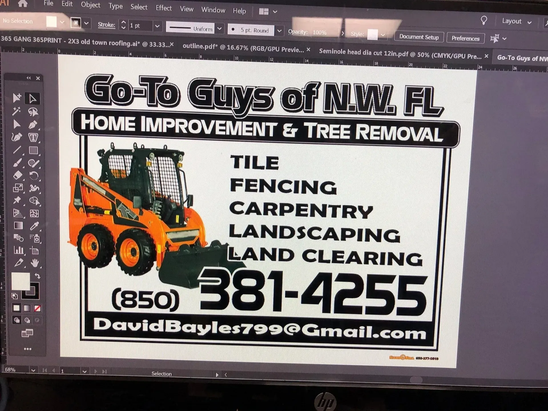 A computer screen shows a sign for go to guys of nw fl