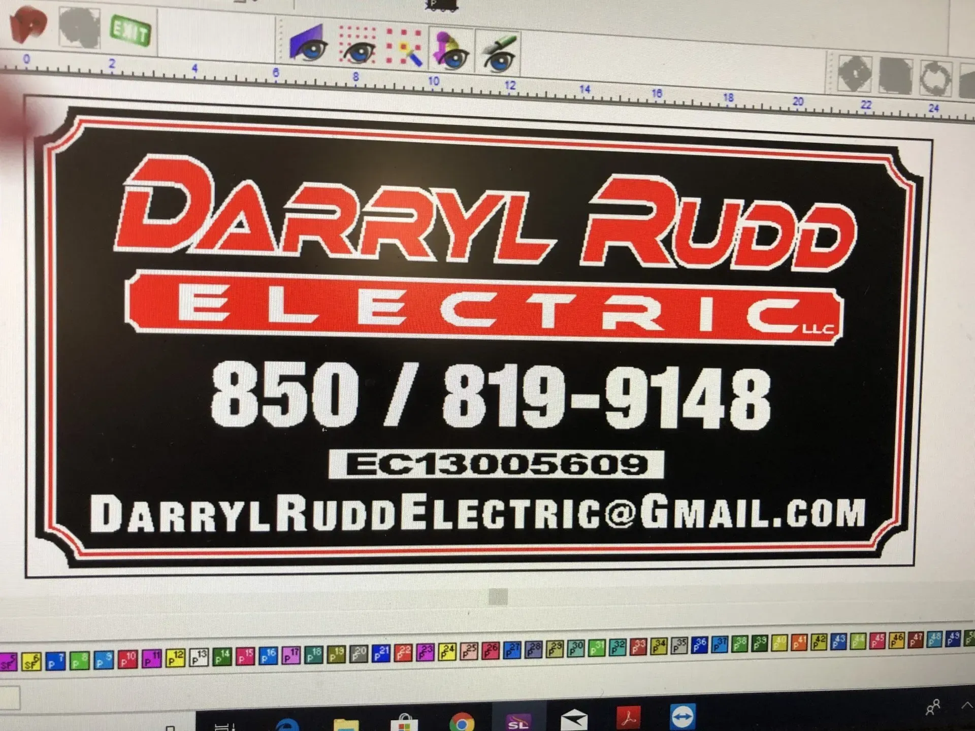 A computer screen shows a sign for darryl rudd electric