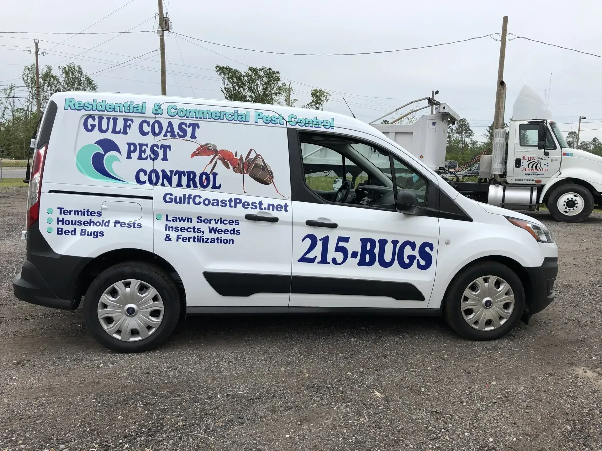 A gulf coast pest control van is parked in a parking lot.
