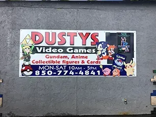 A sign for dusty 's video games gundam anime collectible figures and cards