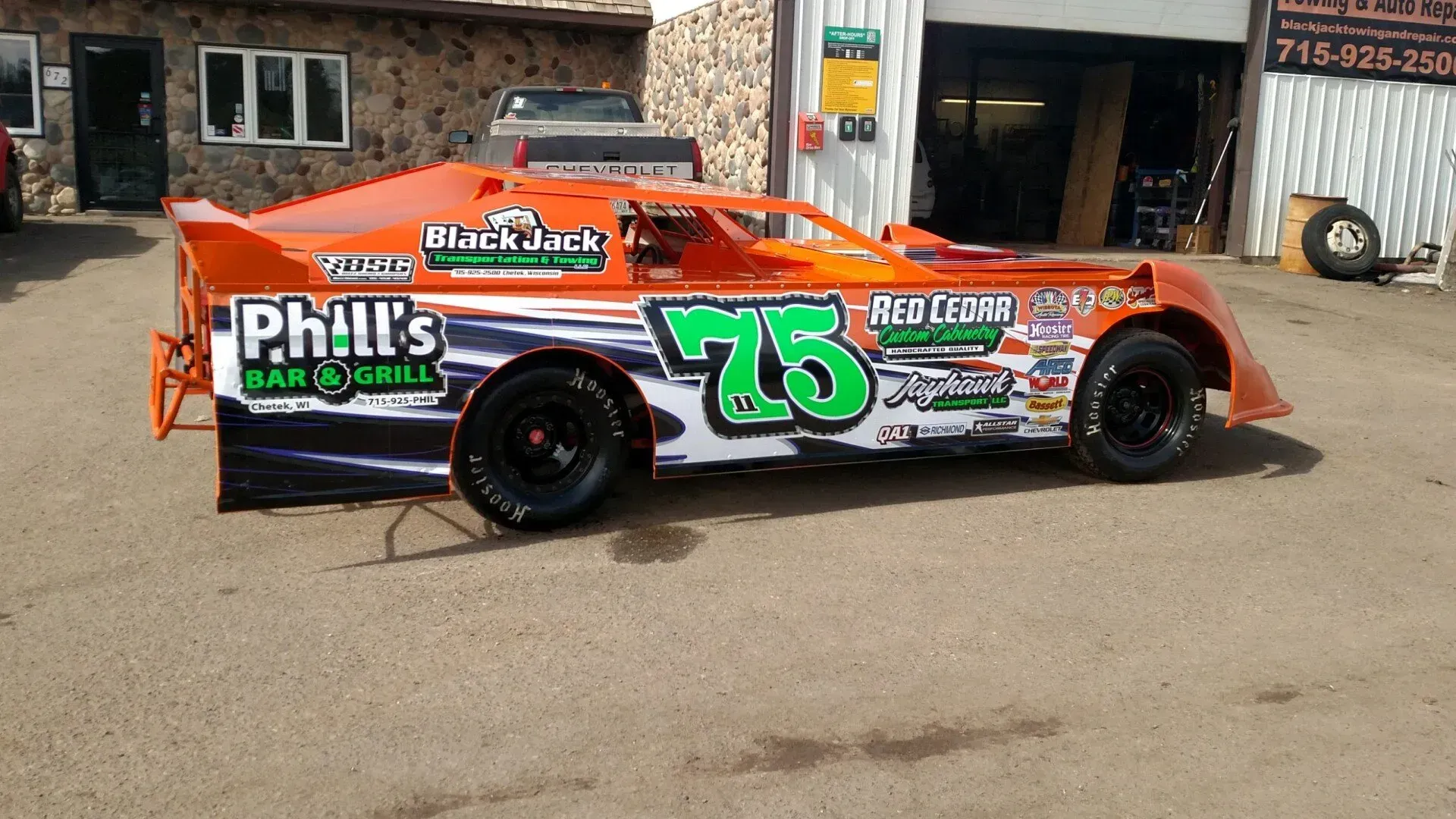 A race car with the number 75 on it.
