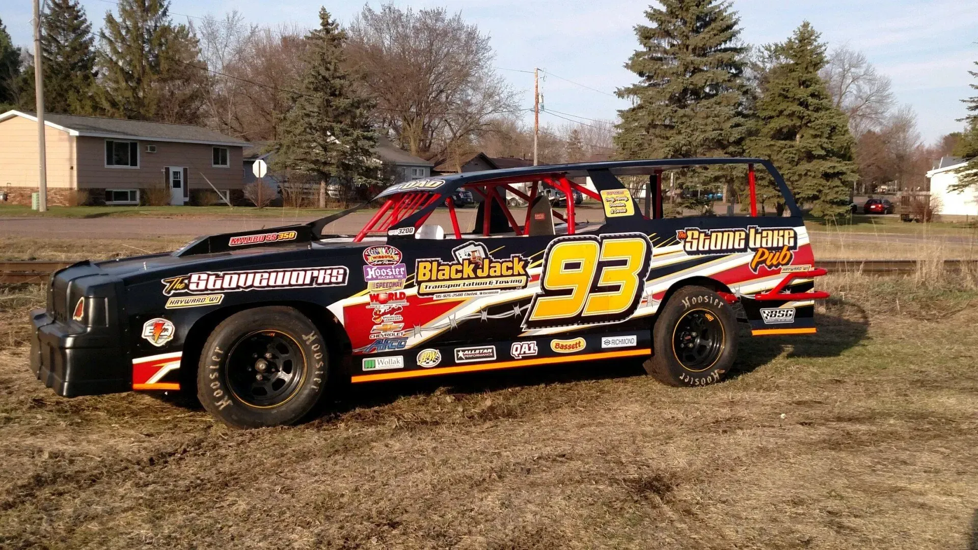 A race car with the number 93 on it.