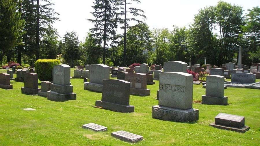 A cemetery with lots of graves including one that says richard