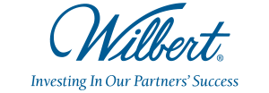 The logo for wilbert is blue and says investing in our partners ' success