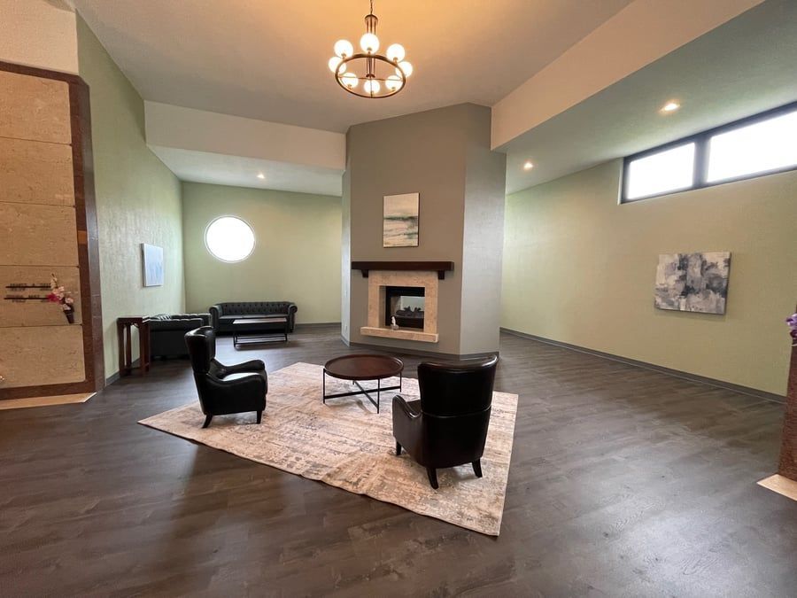 There is a fireplace in the middle of the living room.