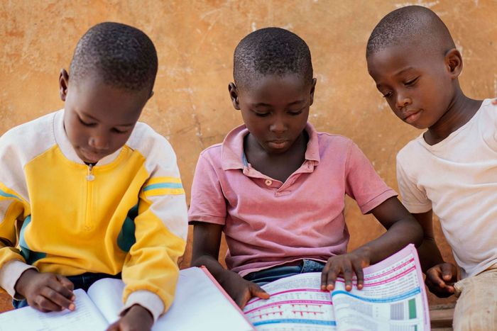 Three Kids Reading Books