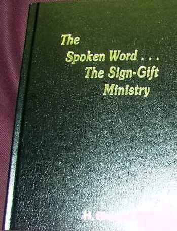 A black book titled the spoken word the sign-gift ministry